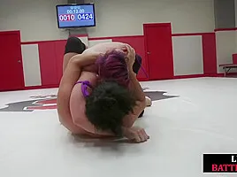 Wrestling Asian lez licks winner muscles after losing fight